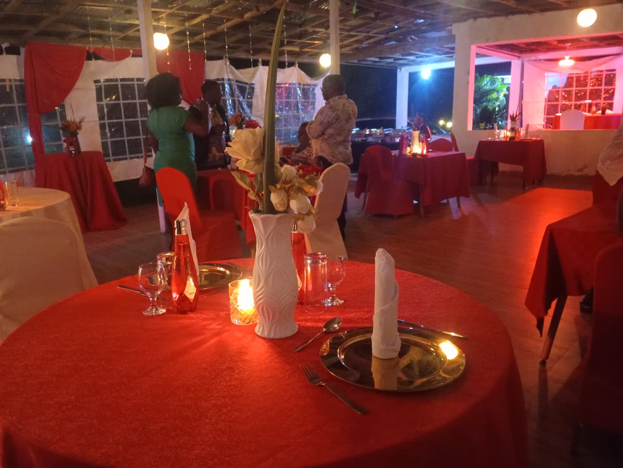 Candle-lit dinner event under fairy lights